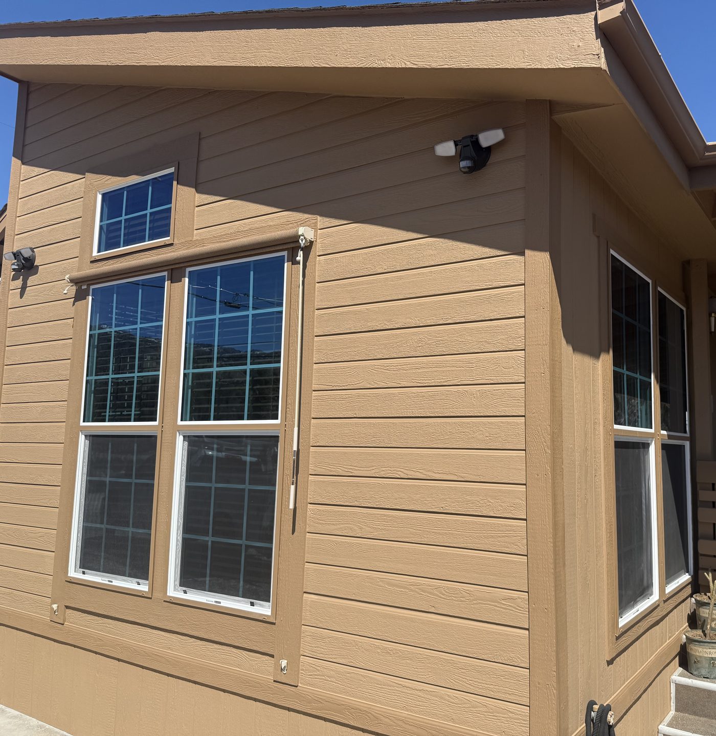 Finished, repainted end of the manufactured home after the rebuild