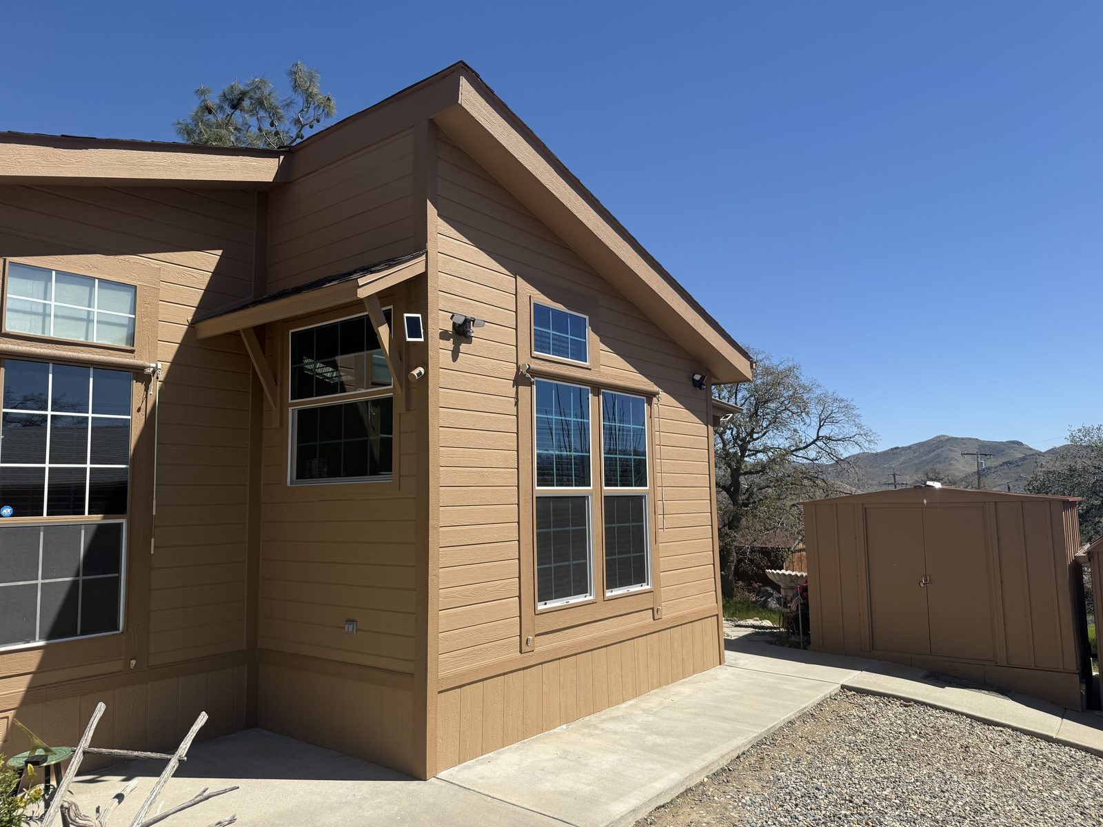 Manufactured home with a rebuilt end section after backhoe impact damage