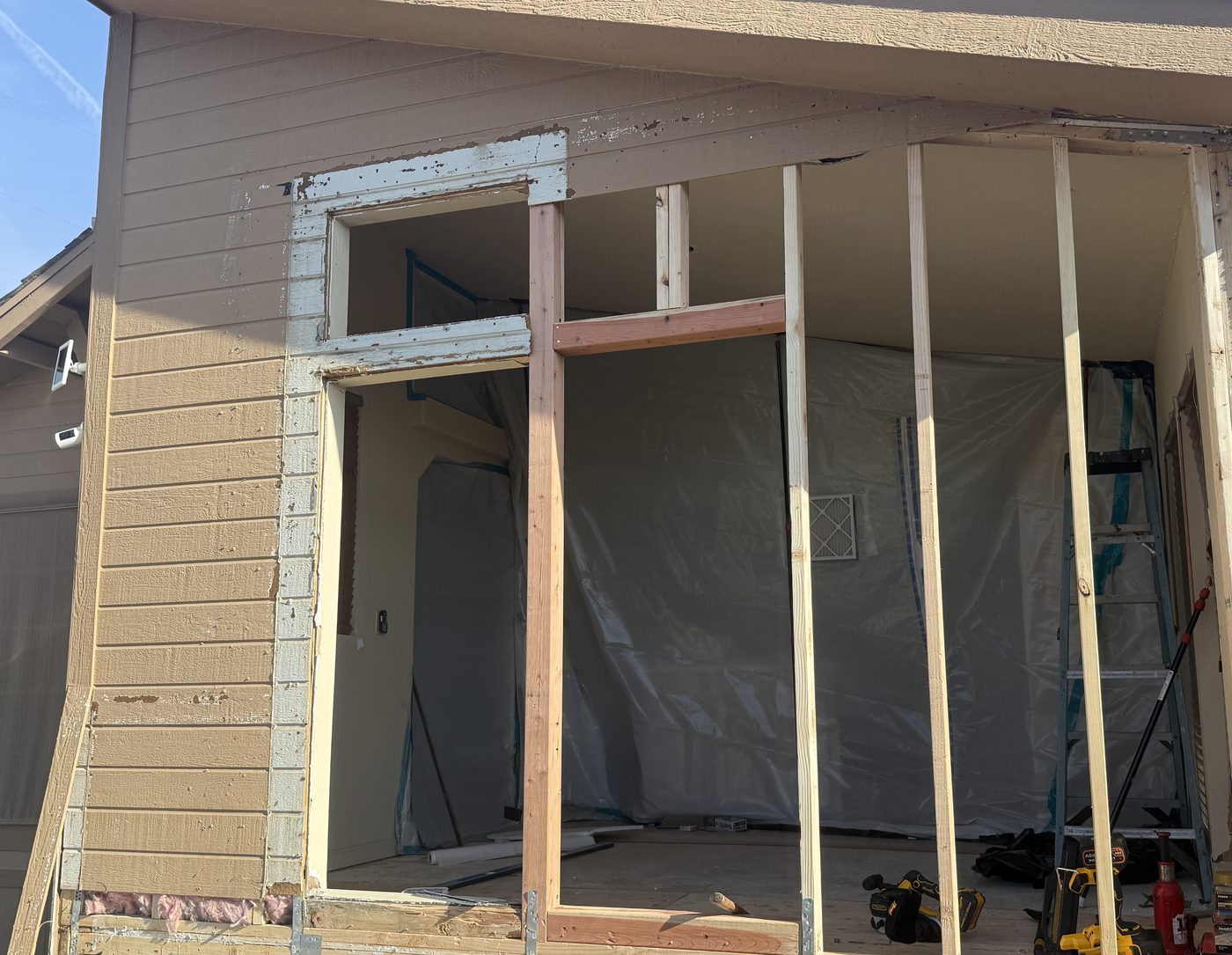 The same end wall framed back up with new wood studs during the rebuild